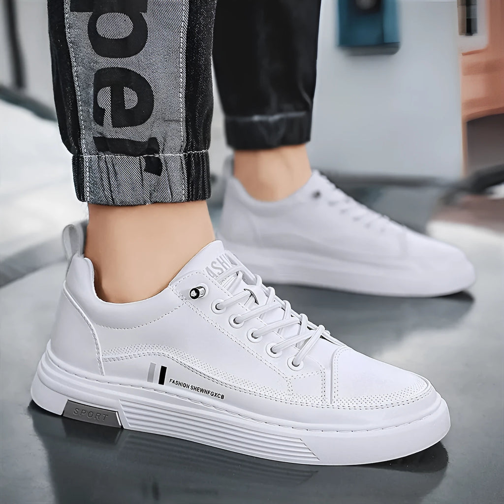 Men's low-top skate shoes in black with microfiber upper, rubber sole, and elastic band.