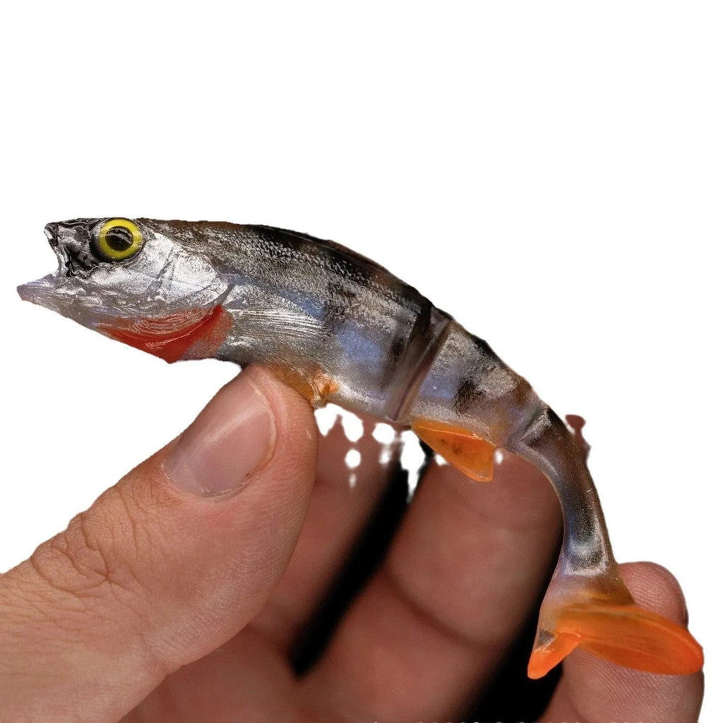 Soft plastic fishing lure in fish shape with T-tail and catfish scissors profile for sea fishing