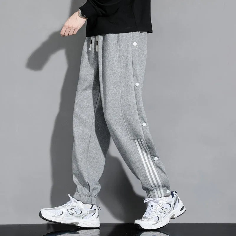 Men's loose fit cotton blend sweatpants with ankle ties and drawstring waistband in black colour