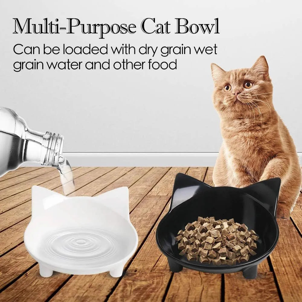 Set of four black shallow melamine pet bowls with non-slip rubber bases on a white surface.