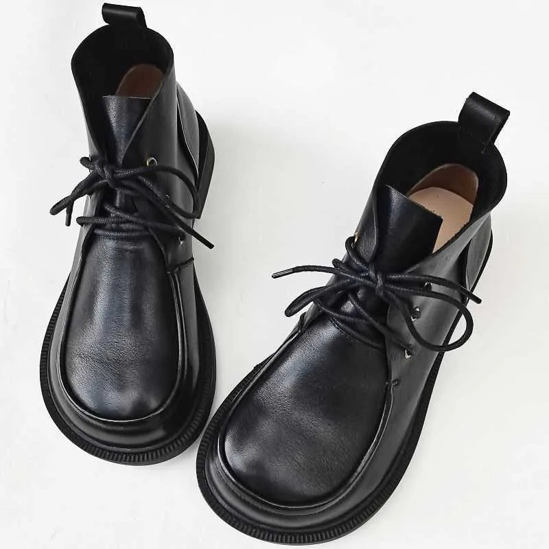 Women's big toe ankle boots in black first layer cowhide leather with rubber sole and hollow-out detail