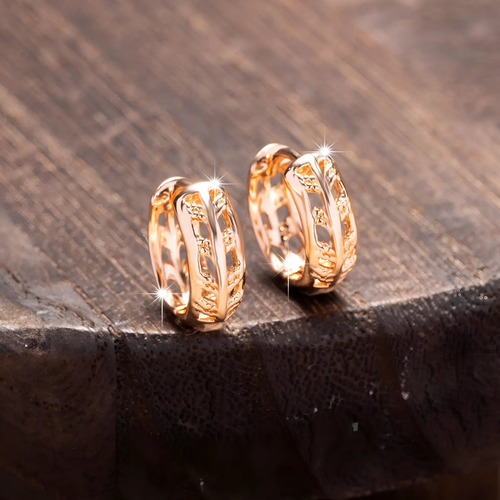 Copper earrings with rose gold finish featuring hollowed-out leaf and heart shapes