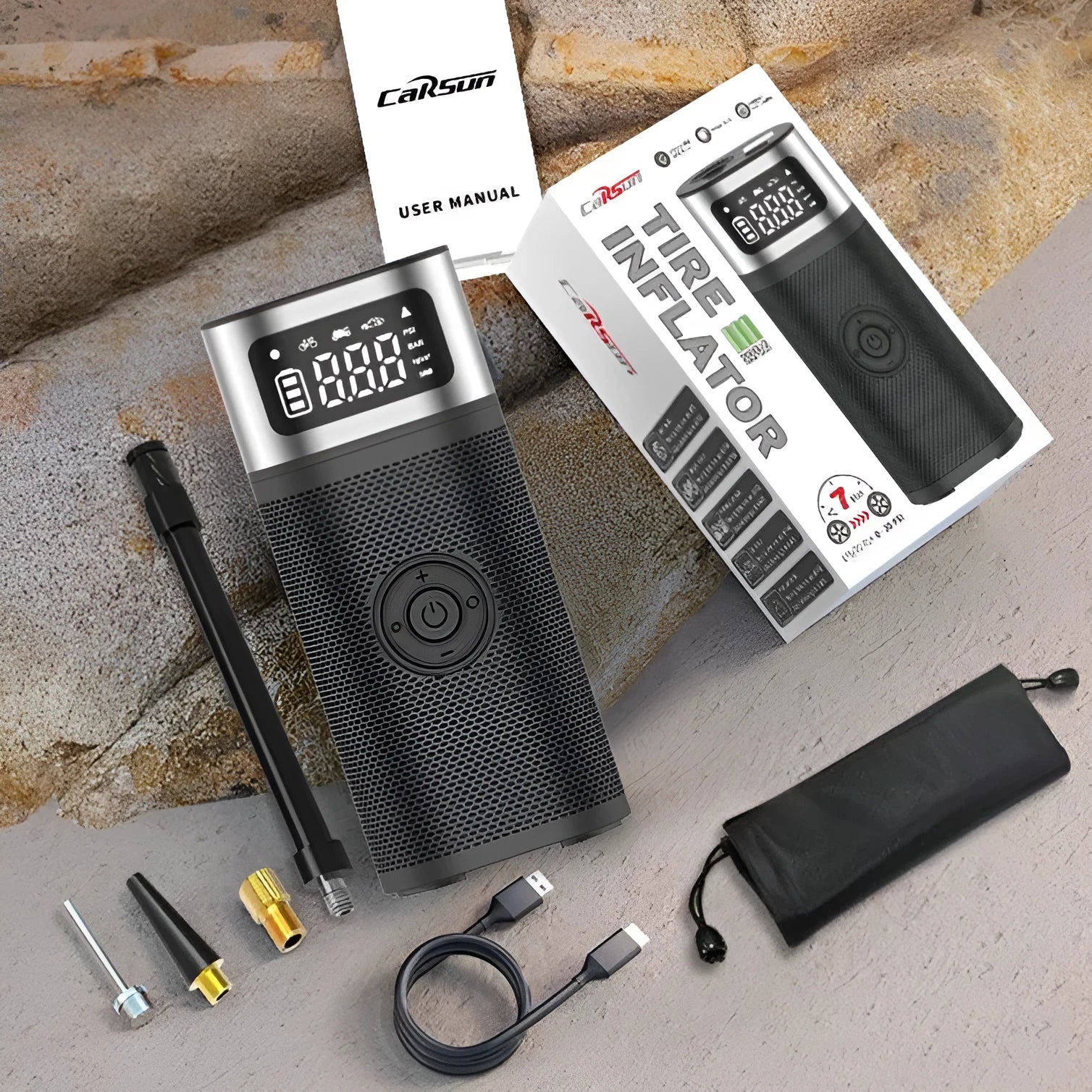 Black portable wireless smart air pump with a 15cm tube and multiple nozzles on a grey background.