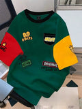 Men's loose-fit printed short-sleeve t-shirt on a model, showing letter pattern detail and casual styling.