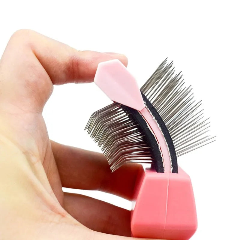 Double-sided pet brush with stainless steel pins on blue ergonomic handle