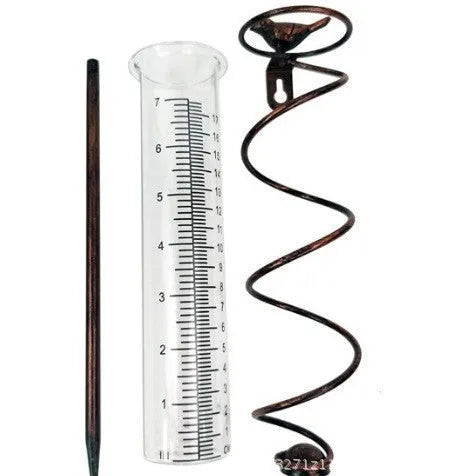 Cast iron garden rain gauge with hummingbird ornament and measurement scale.