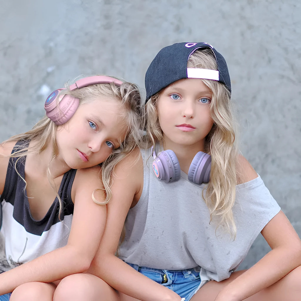 Purple wireless children's headphones with RGB bunny design showing battery display.