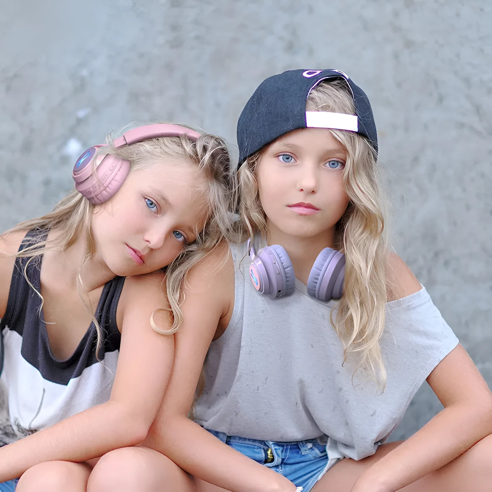 Purple wireless children's headphones with RGB bunny design showing battery display.