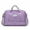 Large grey and pink Oxford cloth leisure travel bag with sewing thread detail on a white background.