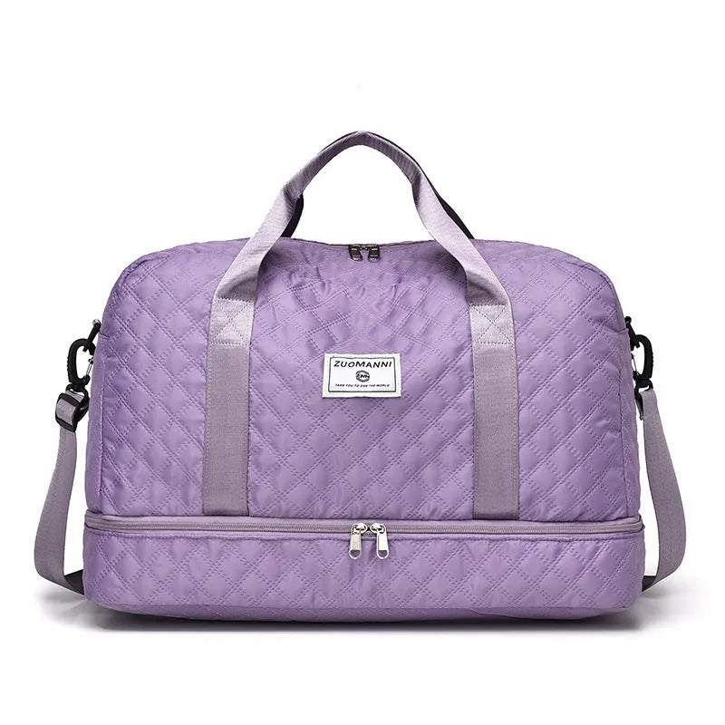 Large grey and pink Oxford cloth leisure travel bag with sewing thread detail on a white background.