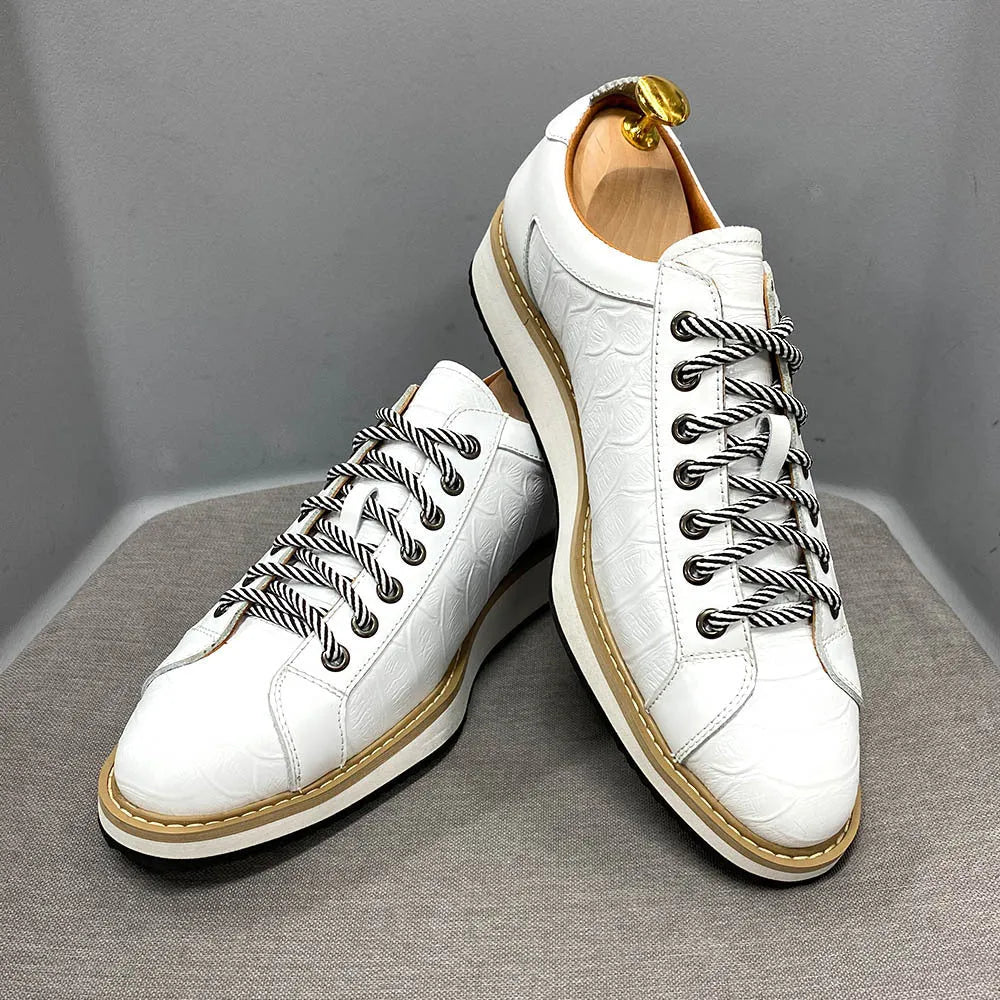 Men's low-top handmade shoes with an embossed pattern and front lace closure, shown in a choice of colours.
