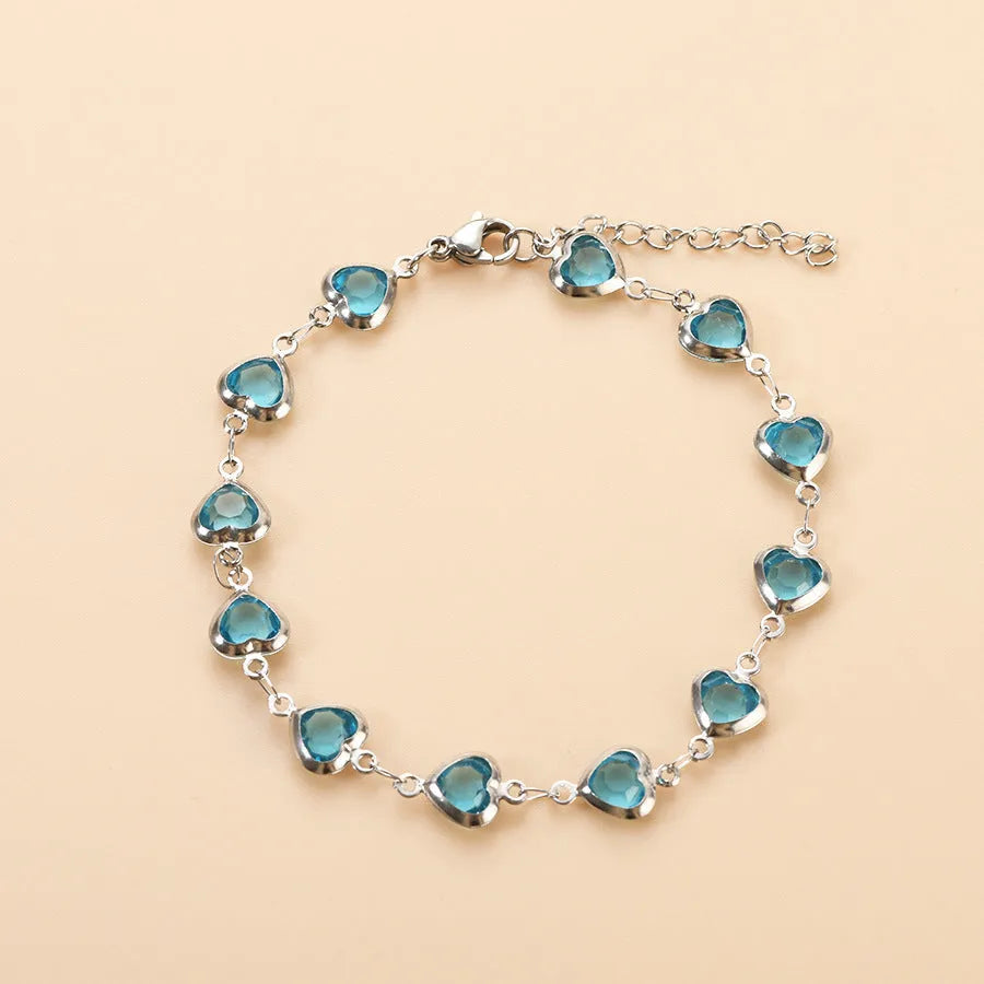 Devil's Eye Creative All-match Fashion Heart Bracelet in stainless steel on a wrist.