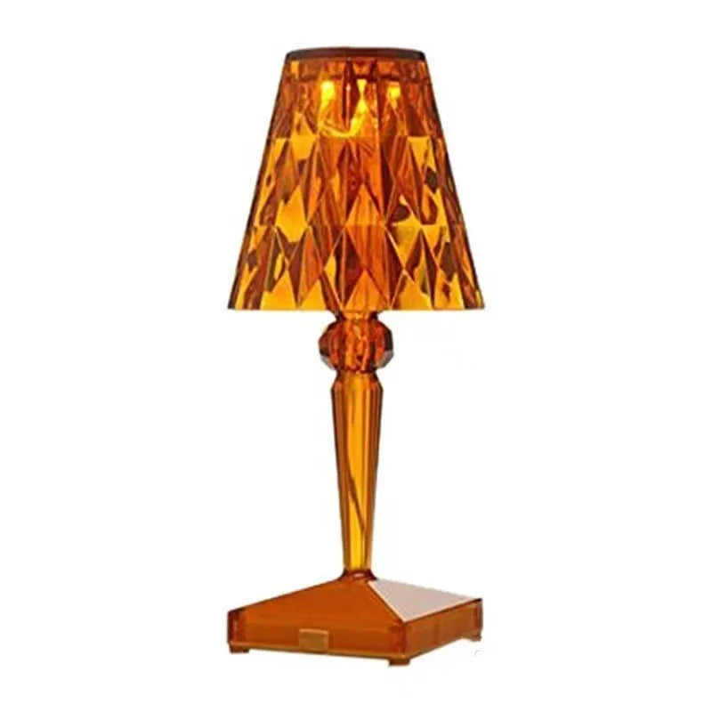 Rose gold plated portable touch control night light on a surface, showing its cubic base and height.