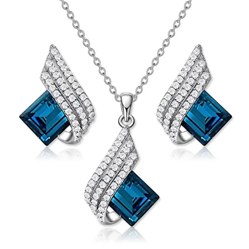 Women's necklace and earring set with glass pendant on cross chain necklace