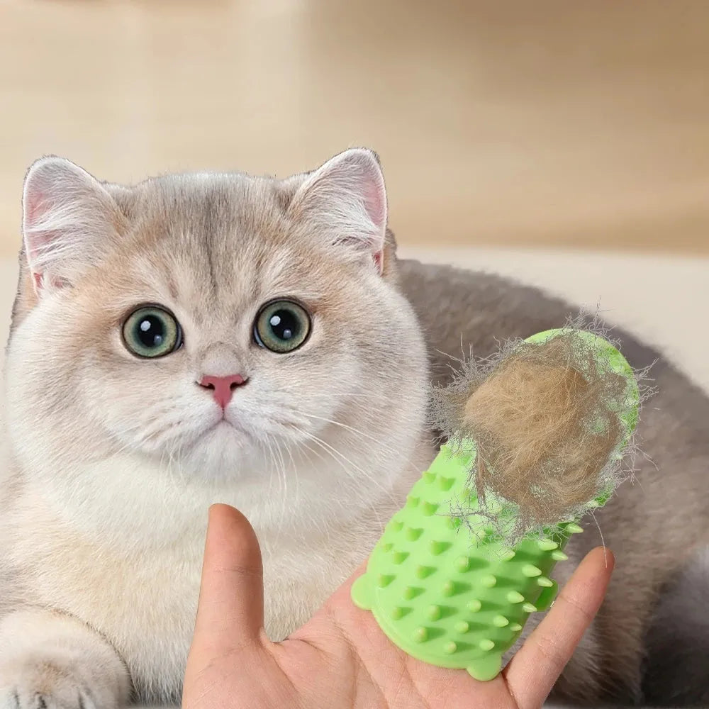 Silicone cat grooming comb with adjustable strap attached to furniture leg for scratching and hair removal