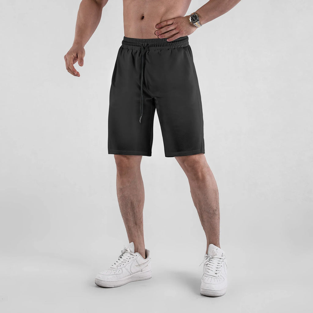 Men's black quick-drying mesh shorts with elastic waist and fifth pants length