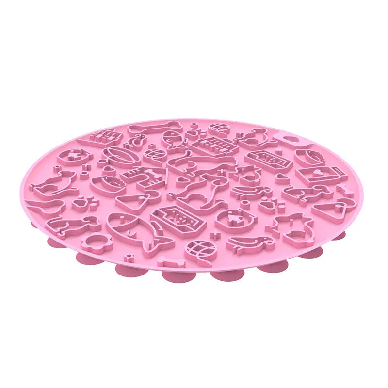 Round blue silicone pet licking mat with a central white suction cup on a kitchen tile.