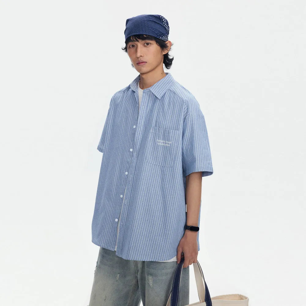 Blue striped loose-fit overalls shirt with short sleeves and cardigan style