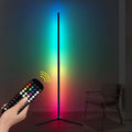 Black aluminium smart RGB floor lamp with silicone shade and remote control on wooden floor