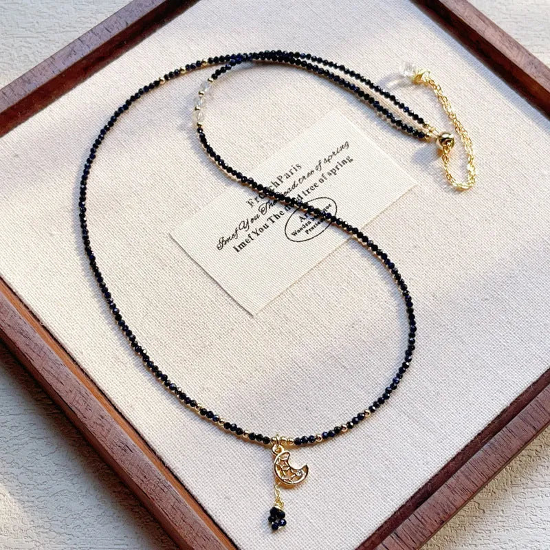 Women's three-ring bracelet with blue sand stone beads in multi-layered gold-tone design