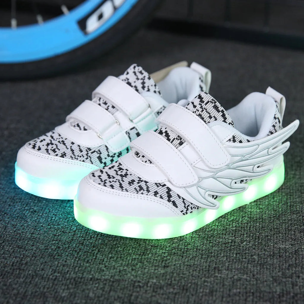 Plum red children's sneakers with illuminated LED soles and a USB charging cable.