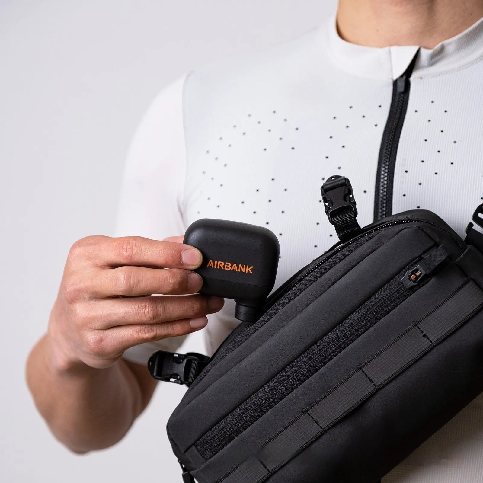 Black AS100 mini electric bicycle tyre pump with USB cable and waterproof storage bag.