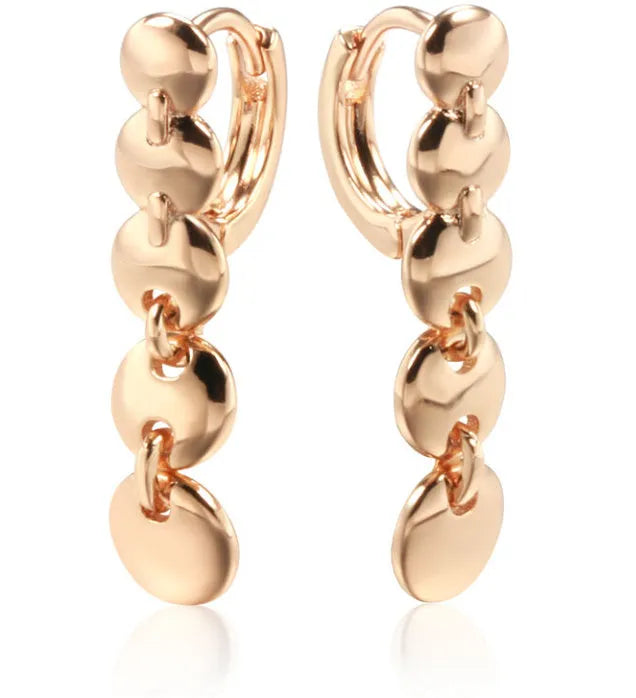 Long gold retro hoop earrings with woven copper texture, shown as a pair.