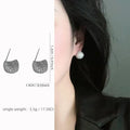 Geometric drop-shaped women's earrings with full diamond detailing and golden bean elements