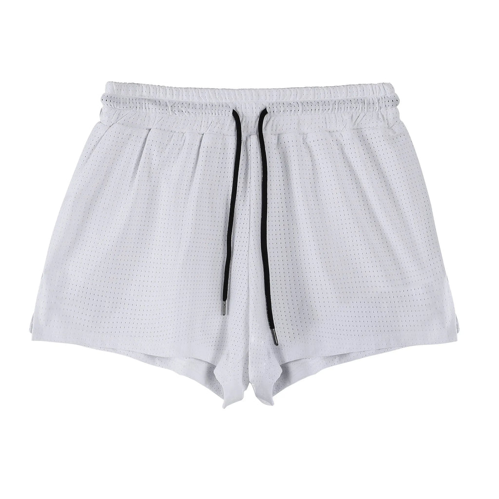 Men's black and white nylon shorts with a mid-waist design for summer sports.