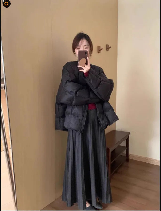 Women's dark grey knitted dress suit with 3D patterning and ethnic collage stitching, showing sweater and skirt two-piece set