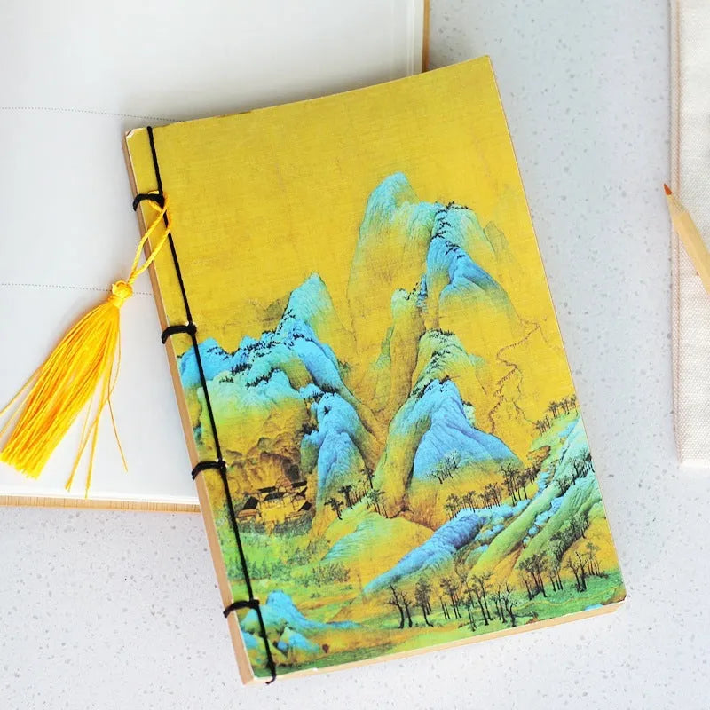 Antique wire-bound notebook with embossed cowhide cover and black wax rope binding