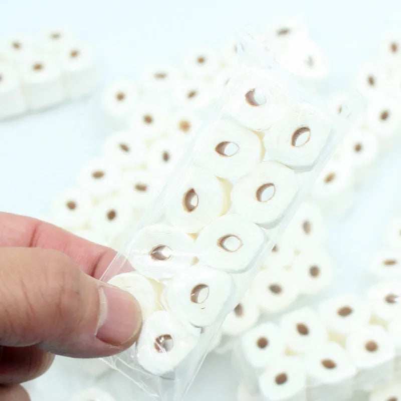 Miniature paper tissue roll model for dollhouse play measuring 30x15x80mm