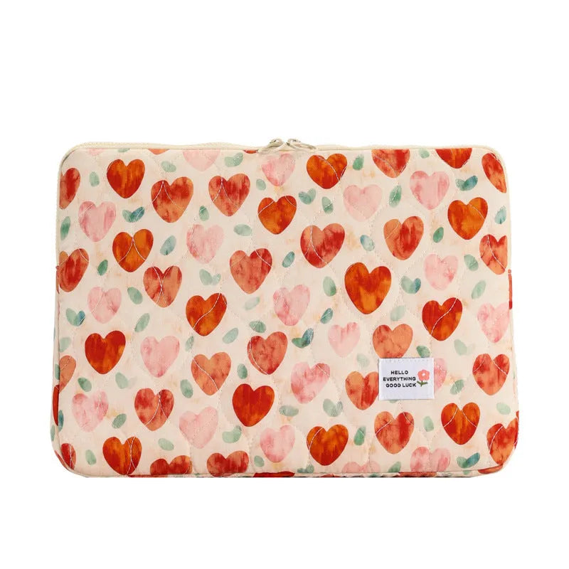 Green floral print cloth laptop bag showing front storage pocket and slim 3cm depth profile.