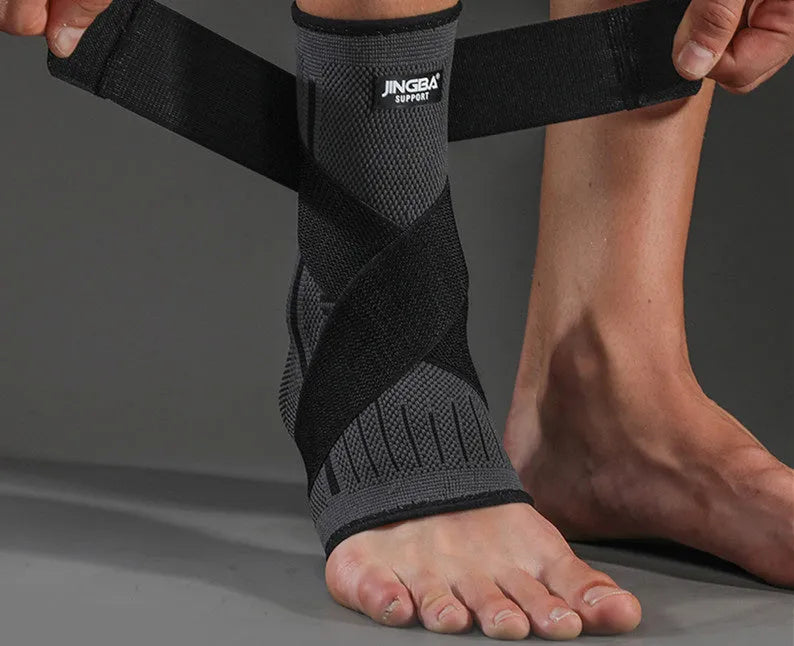 Sports ankle support brace in black colour shown on ankle during athletic activity