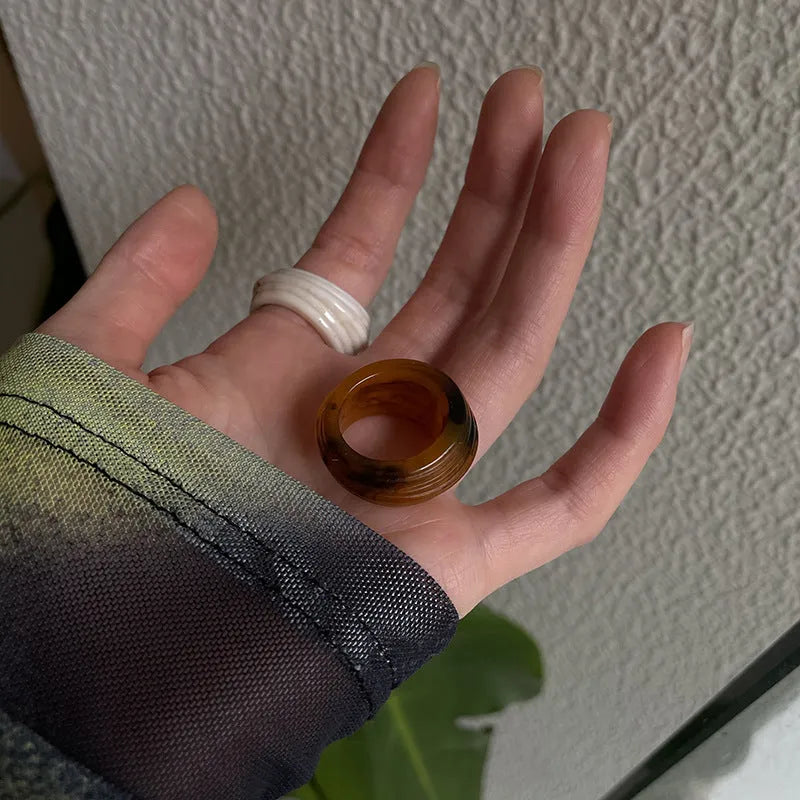Chinese style irregular geometric resin wide ring in brown and white colours.