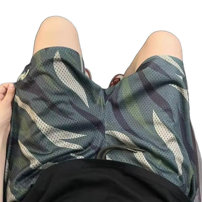 Men's camouflage pattern mesh shorts with straight leg cut