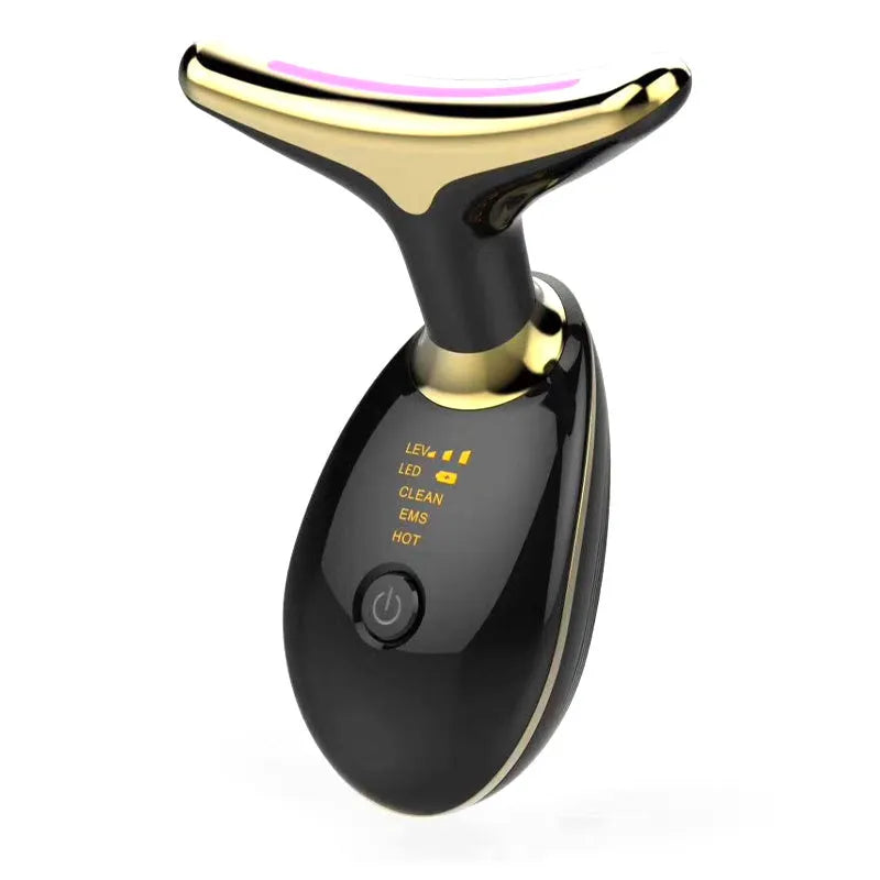 White EMS thermal neck massager device with LED lights on a stand next to USB cable.