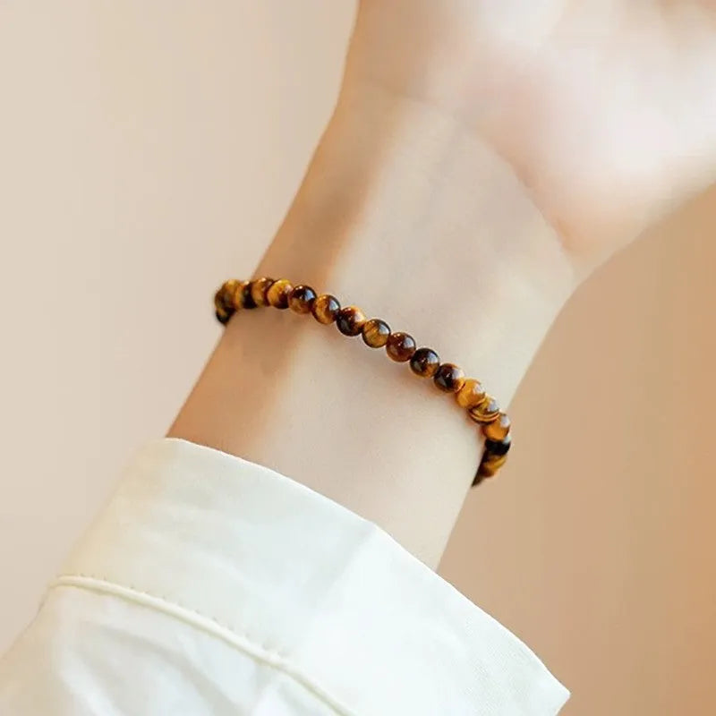 Handcrafted tigereye bracelet in new Chinese style with geometric round elements, shown in 4mm, 6mm, and 8mm bead sizes.
