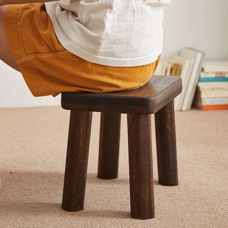Wooden shoe changing stool with distressed finish and bracket leg structure