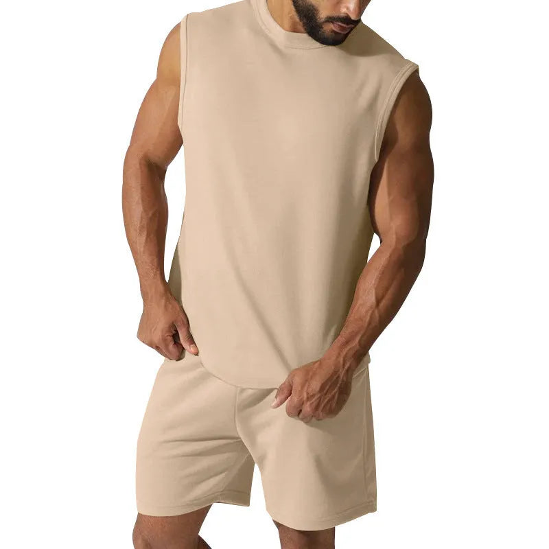 Men's sleeveless cotton-blend sports suit showing matching T-shirt top and shorts in a solid colour.
