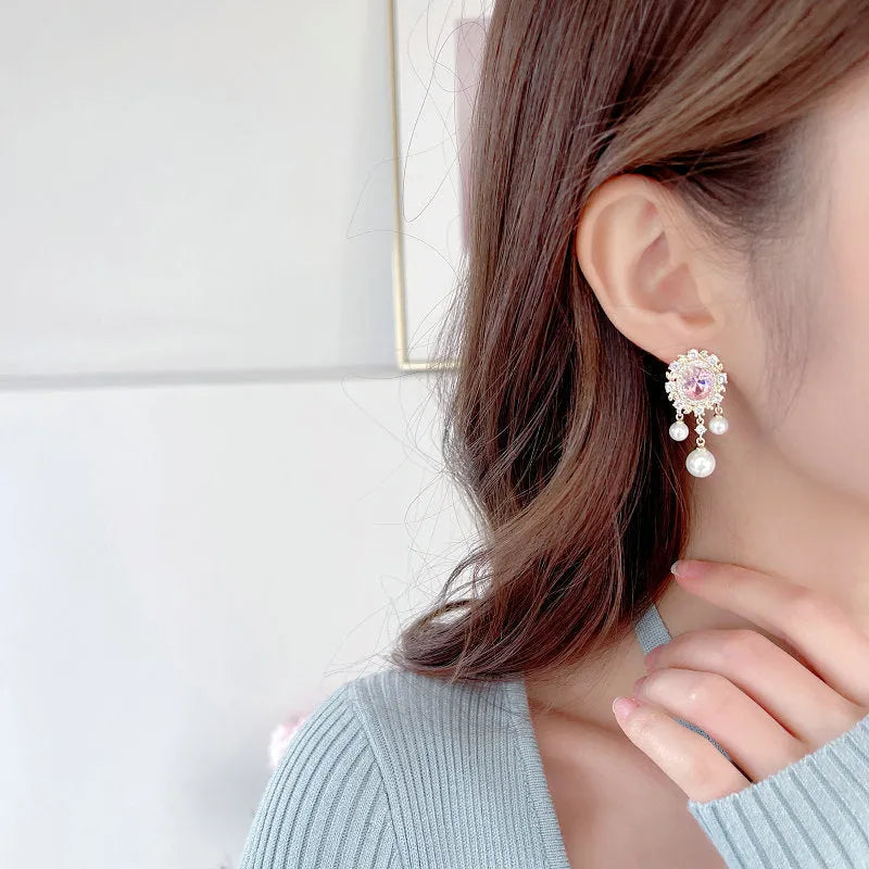 Oval geometric copper earrings with zircon inlay and pearl tassels in light purple colour