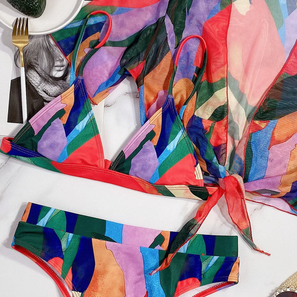 Red women's printed split design swimsuit or bikini made from nylon fabric.