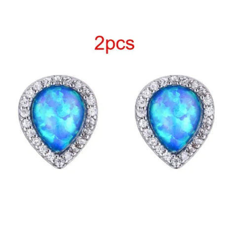 Blue opal drop-shaped stud earrings on copper base with inlaid gem setting