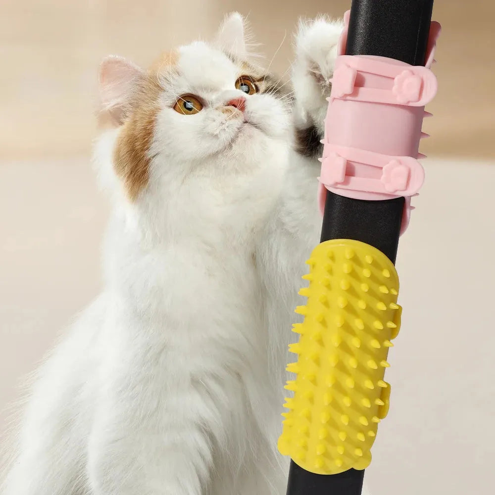 Silicone cat grooming comb with adjustable strap attached to furniture leg for scratching and hair removal