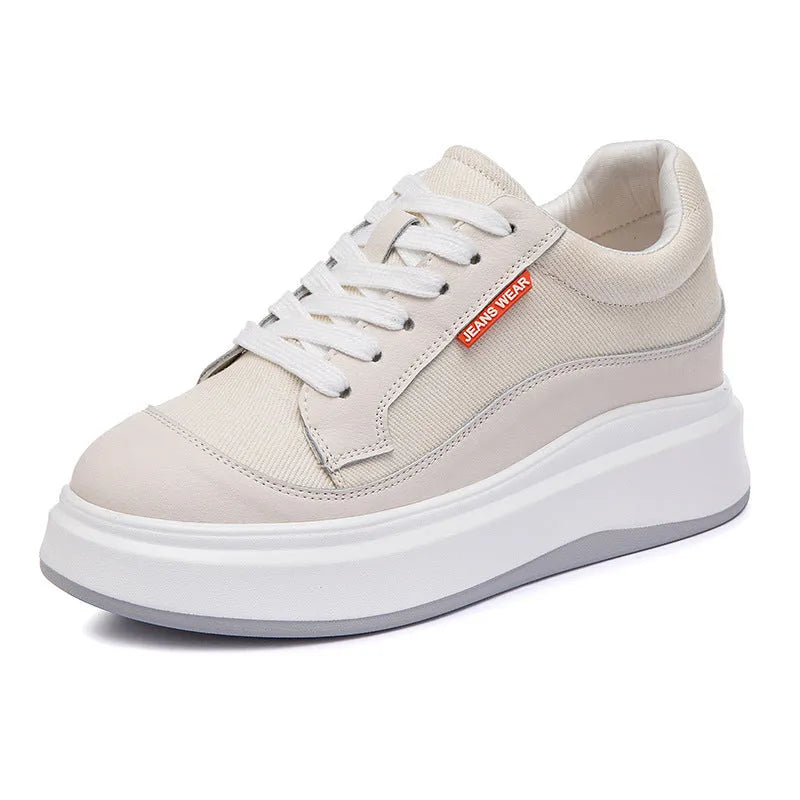 Women's beige and pink leather platform shoes with thick soles, shown from the side.