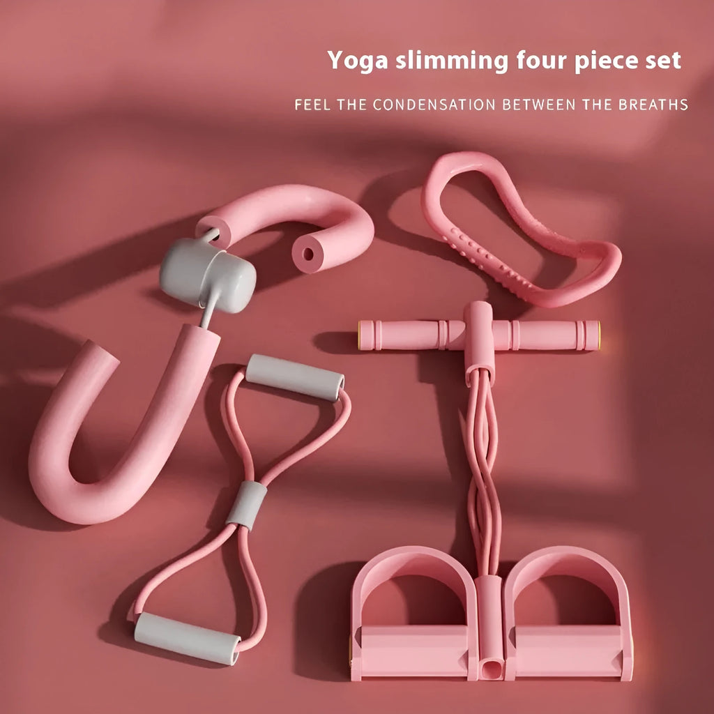 Yoga four-piece fitness set showing leg stretcher, ring, pedal device, and tension rope on a floor.