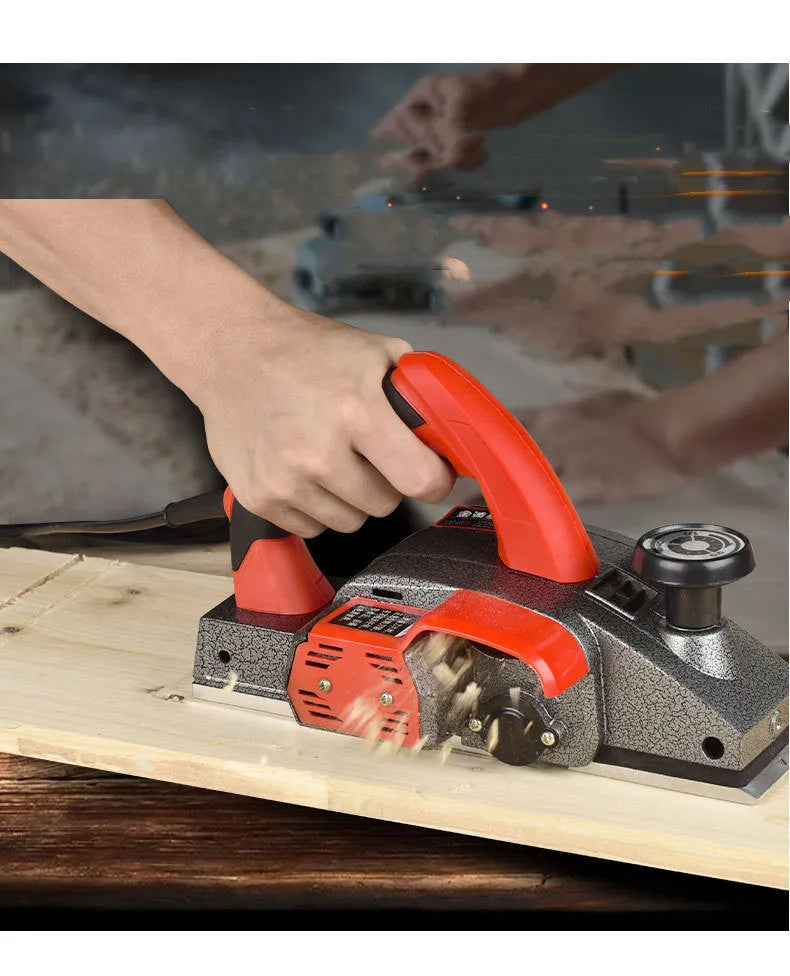Red desktop electric wood planer with 82mm cutting width and aluminium housing