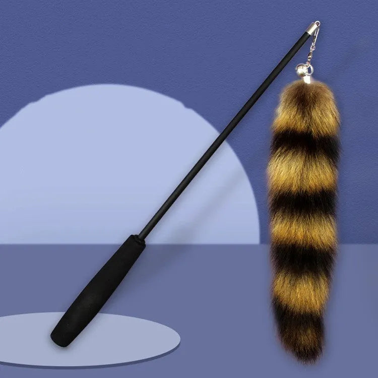 Black cat toy wand teaser with a long handle and elastic string for interactive play.