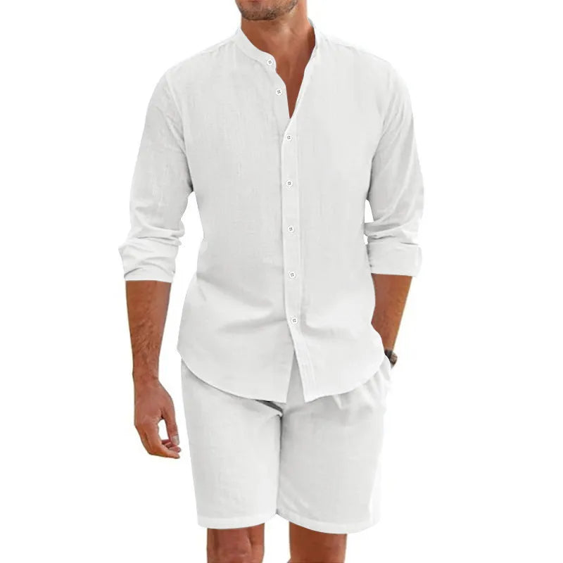 Man wearing a dark grey linen blend short sleeve shirt and matching drawstring shorts summer suit.