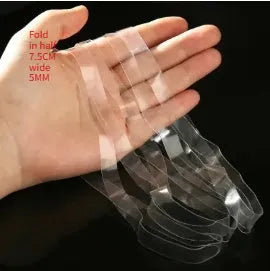 Transparent white TPU rubber bands of various sizes on a light surface